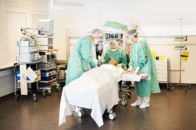 Medical team preparing the patient for an operation