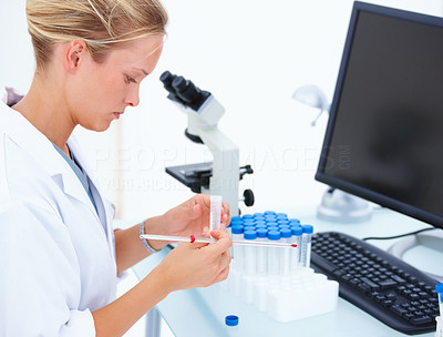 Female researcher doing research in laboratory