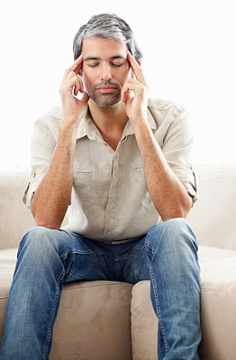 Peaceful thinking - Middle aged man sitting with eyes closed