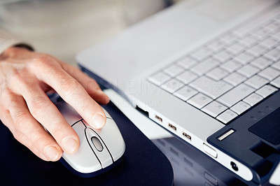 Cropped image of a business woman using a mouse at work