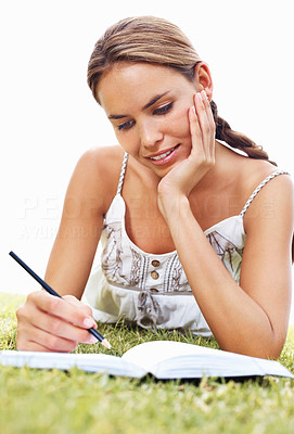 Woman studying on grass