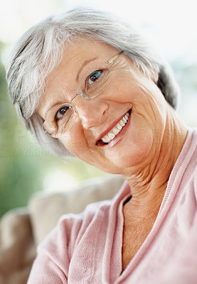 Friendly retired woman giving you a warm smile