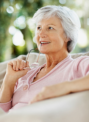 Old relaxed woman deep in thought