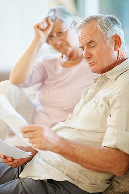 Old man and his wife going through documents