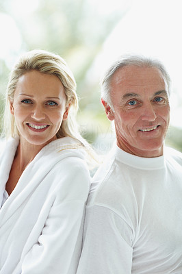 Back to back - Portrait of a mature couple smiling