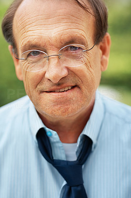 Closeup of a senior business man wearing glasses