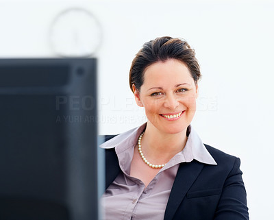 Pretty middle aged business woman smiling at work