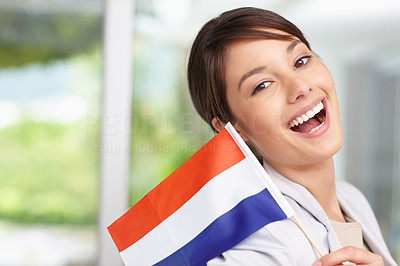 Pretty happy female holding Netherlands flag
