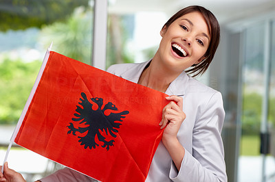 Cute young female displaying an Albanian flag