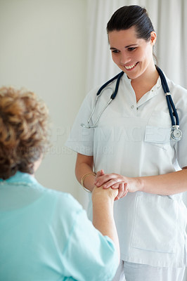 Young nurse having a casual talk with a patient