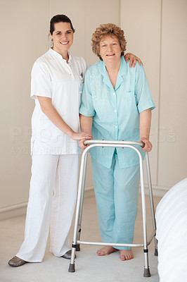 Portrait of a nurse and a senior woman with a walker