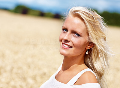 Cute woman smiling while at the countryside on a sunny day