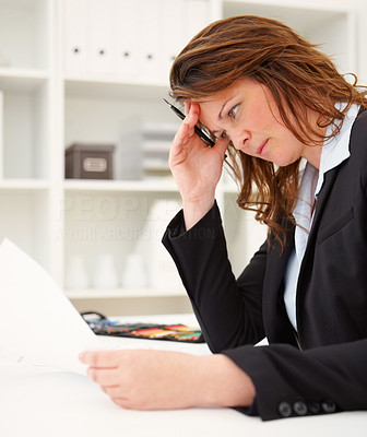 Worried business woman reading a document