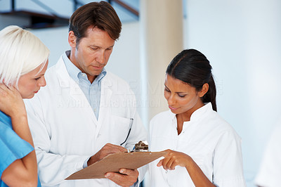 Team of doctors checking medial report