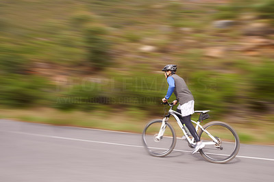 Speeding along on his bike