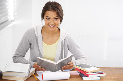 Hitting the books with a smile on her face