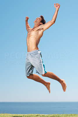 Shirtless man jumping
