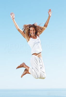 Cheerful woman jumping in air