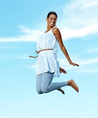 Pretty young lady jumping in joy
