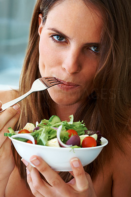 Be vegetarian - Beautiful young woman eating fruit salad