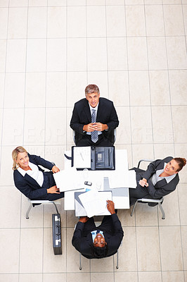 Above view: Business people looking up while sitting in the office