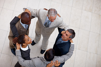 Top view of a team of business colleagues together in a circle