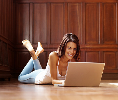 Happy young female working on laptop