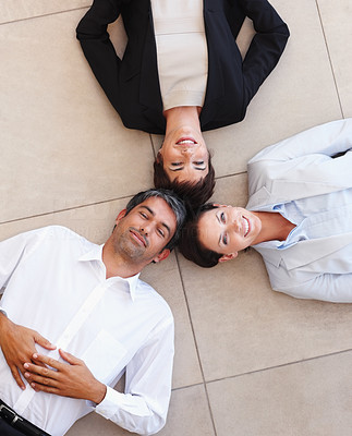 Business colleagues lying on the floor