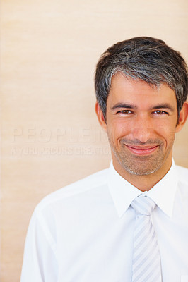 Happy business man isolated over brown background