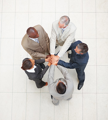 Top view of business colleagues with their hands together in unity