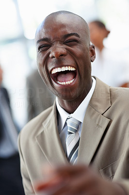 A laughing African American business man