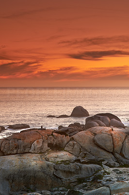 Scenic sunset over a rocky coastline