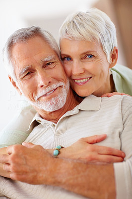 Portrait of an senior old couple embracing together