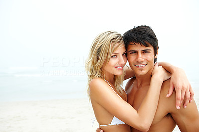 An attractive hot couple enjoying themselves at the beach