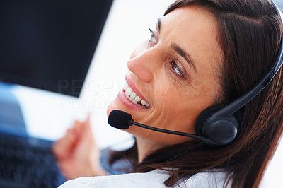 Closeup of a beautiful gorgeous female business executive communicating using headsets