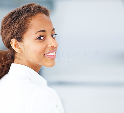 Portrait of a cheerful young female smiling over a background