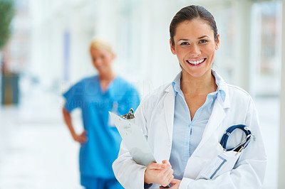 Happy medical doctor with stethoscope and clipboard