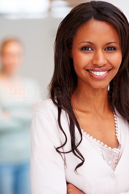 Portrait of a beautiful young African American female with another female at the back