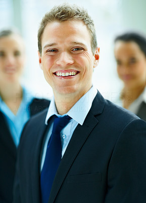 Blur portrait of a positive happy confident businessman smiling towards the camera