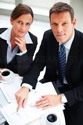 Portrait of business people working together and having tea