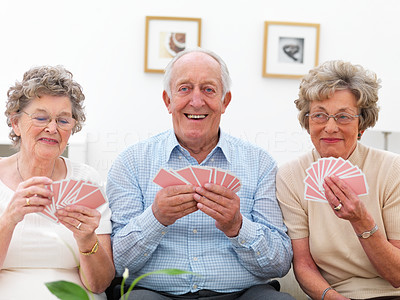 Portrait of a group of mature people holding cards