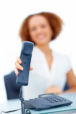 Female executive handing out telephone receiver