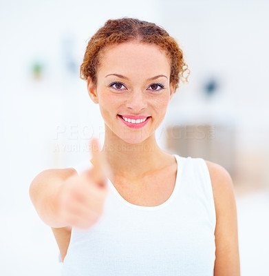 Woman in a positive attitude showing thumbs up