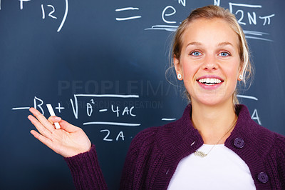 Education - Joyful female teacher teaching algebra