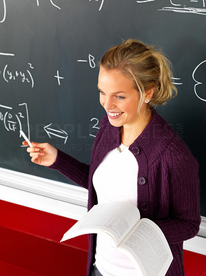 Attractive modern teacher teaching math