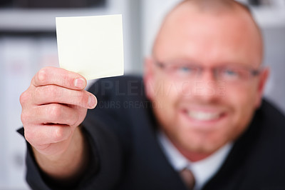 Friendly businessman showing blank space
