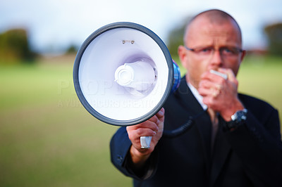 Businessman shouting in megaphone about copyspace
