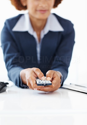 Business woman holding remote control