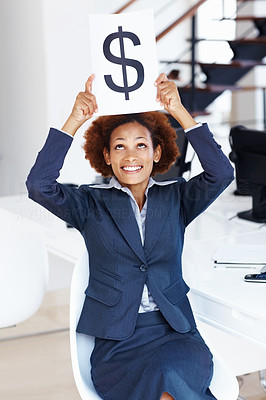 Earning top dollar! - Business woman holding dollar signboard