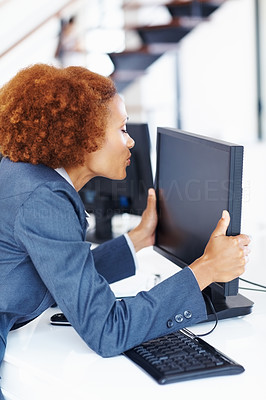 Business woman kissing computer monitor